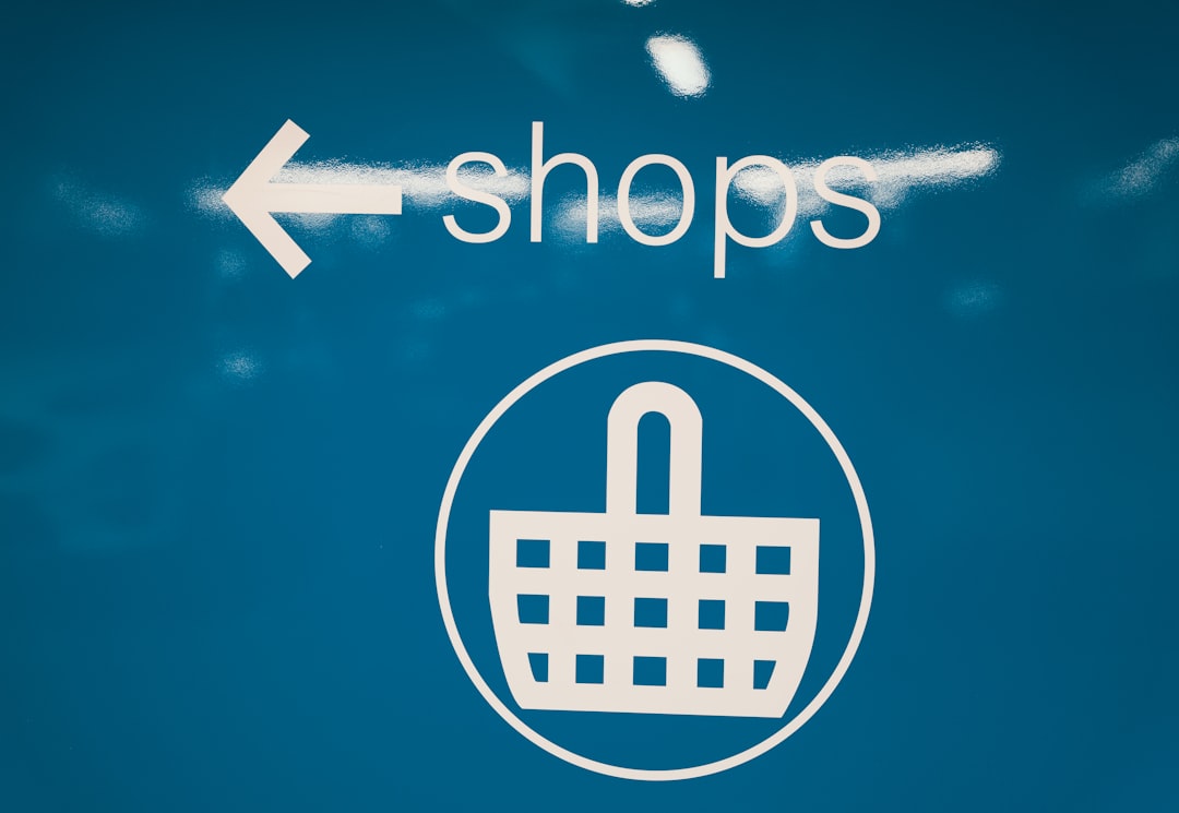 a-blue-sign-with-a-shopping-basket-on-it-7gssp-pleam